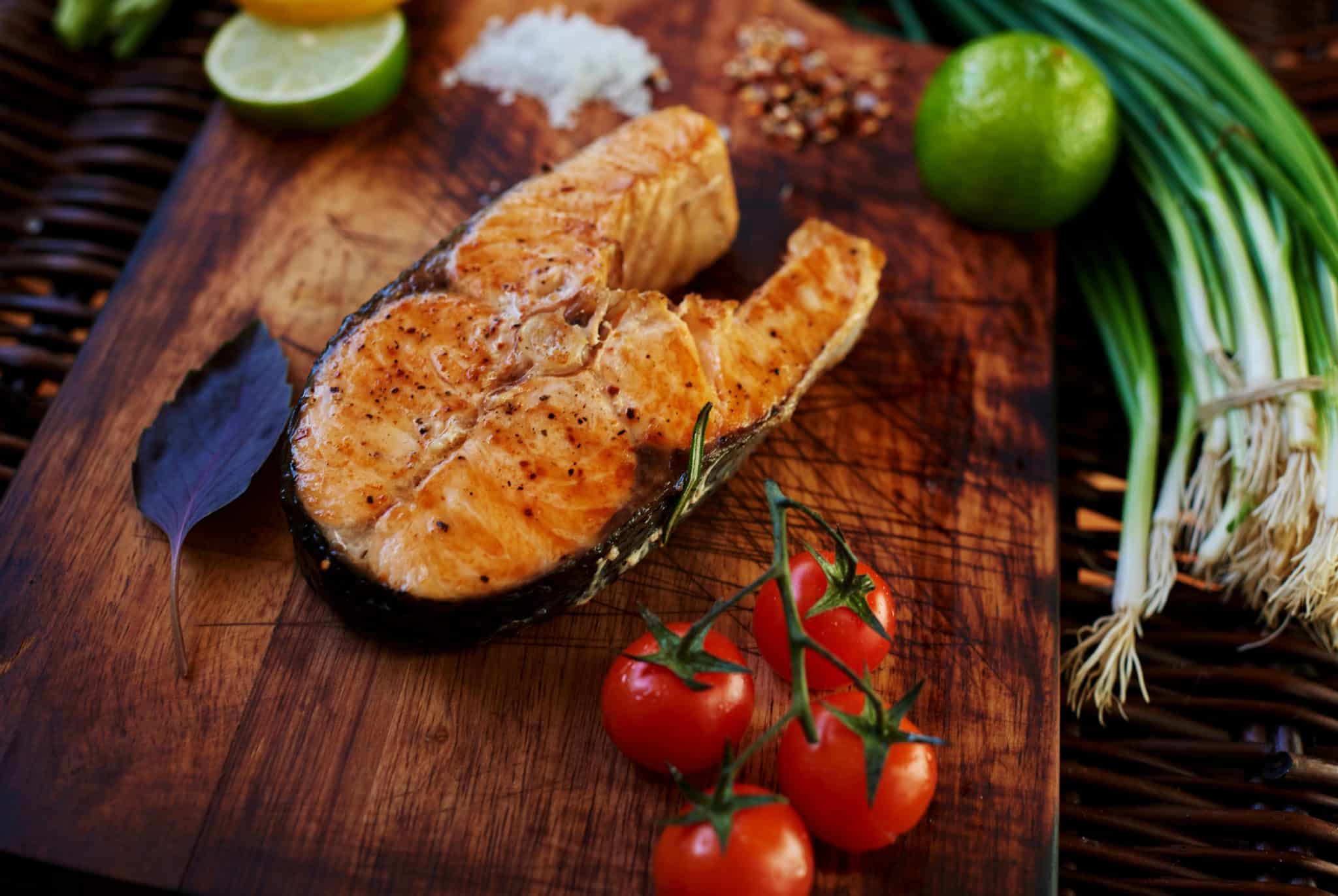 protein salmon grilled with tomatoes in importance of carbs and protein in daily meals