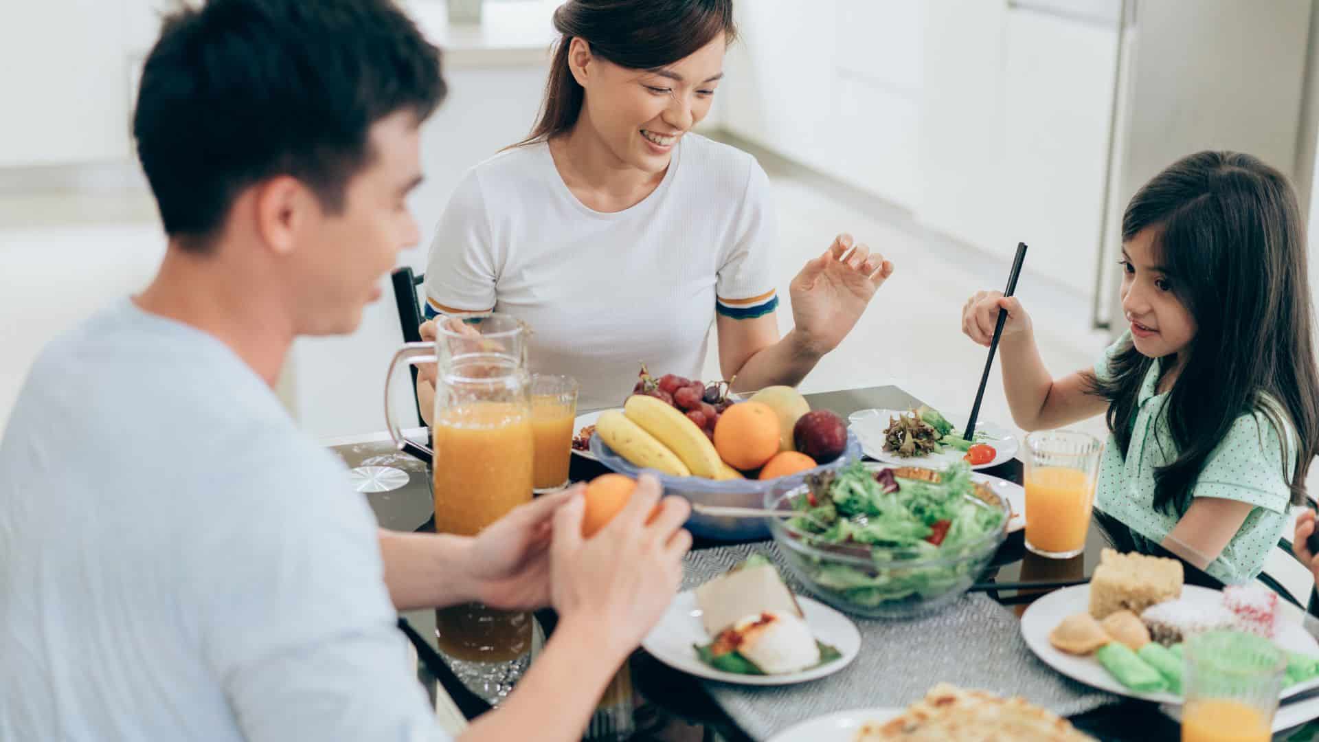 young family eating healthy with fresh ingredients